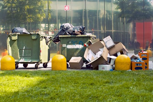Construction workers sorting building materials for waste disposal in Southgate