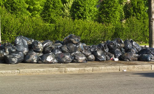 Workers managing construction debris safely