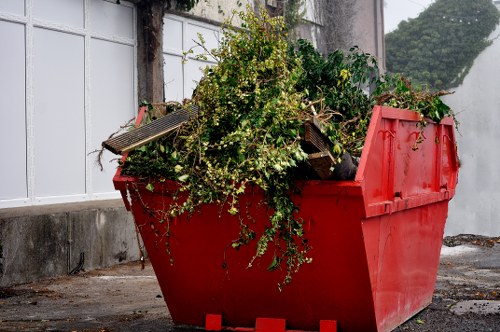 Team handling garden waste removal equipment
